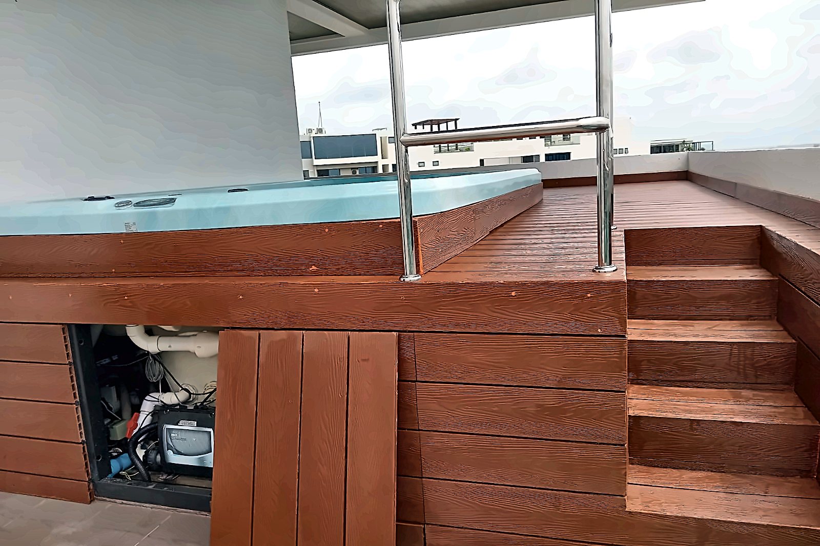 Hardwood decking and steps around a completed rooftop spa